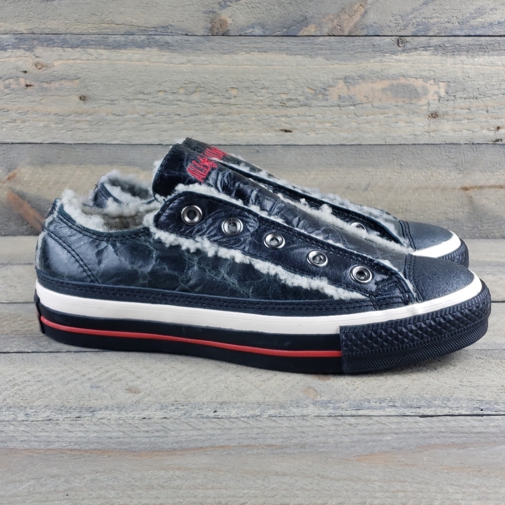 Converse Low-Top Slip-On Sneakers in Black with Red Accent